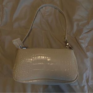 white faux leather baguette bag
